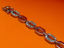 Picture of “Octagonal link” bracelet in sterling silver of which every second link is inlaid with round cubic zirconia