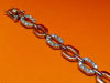 Afbeeldingen van “Achthoekige schakel” armband in sterling zilver waarbij elke tweede schakel ingelegd is met ronde kubiek zirkonia