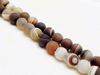 Picture of 8x8 mm, round, gemstone beads, natural striped agate, caramel to deep brown, frosted