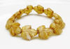 Picture of 16x14 mm, Czech druk beads, maple leaf, flax light gold, matte, bronze patine, 6 pieces