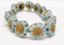 Picture of 14x14 mm, Czech druk beads, Hawaiian flower, sky blue, matte, patina old gold effect