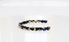 Picture of 3x3 mm, Czech faceted round beads, black, opaque, California blue gold luster