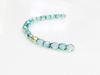 Picture of 3x3 mm, Czech faceted round beads, transparent, light emerald green shimmering