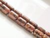 Picture of 9x6 mm, drum-shaped, gemstone beads, leopard skin jasper or red Mexican Rhyolite, red, natural