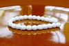 Picture of 4x4 mm, Czech faceted round beads, chalk white, opaque