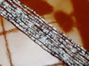 Picture of Czech seed beads, size 11/0, pre-strung, apparition, a mix of crystal, white and grey