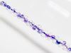 Image de 2x4 mm, perles rocaille japonaises en forme d'arachide, transparent, cristal, doublé violet, lustré arc-en-ciel
