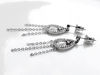 Picture of “Framed crystal drop” earrings in sterling silver,  a crystal drop suspended in a tear-shaped loop with CZ