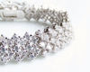 Picture of “Zirconia in rhombus setting” bracelet in sterling silver, a wave of  round cubic zirconia in rhombus pattern