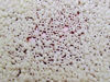 Picture of Japanese seed beads, round, size 15/0, Miyuki, opaque, limestone beige white