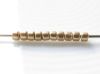Picture of Czech cylinder seed beads, size 10, metallic, flax or light gold, matte, 5 grams